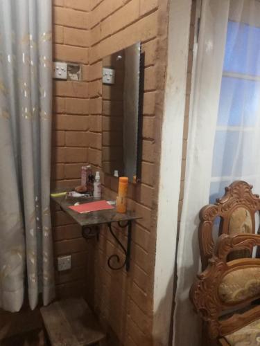 a bathroom with a sink and a mirror at Samara Nature Paradise in Kalutara