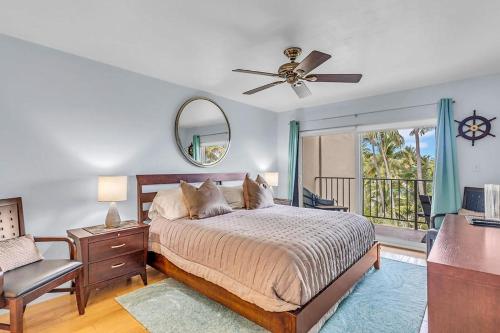 a bedroom with a bed and a ceiling fan at Palms 417 in Islamorada