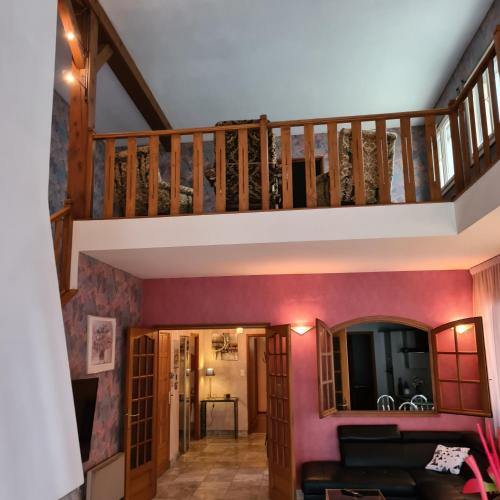 a staircase in a house with a living room at Le Gîte de Massiac in Massiac