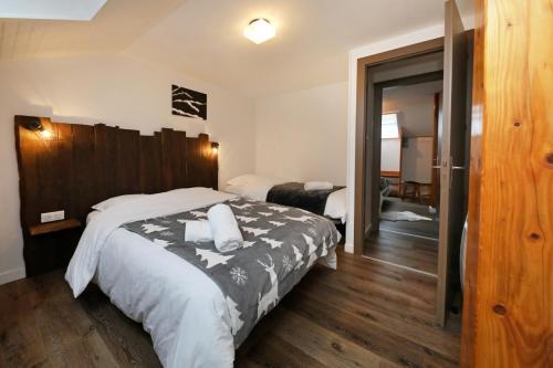 En eller flere senge i et værelse på Maison de caractère Hautes-Vosges - proche Gérardmer