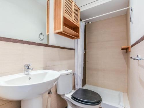 a small bathroom with a sink and a toilet at apartamento cava baja in Madrid