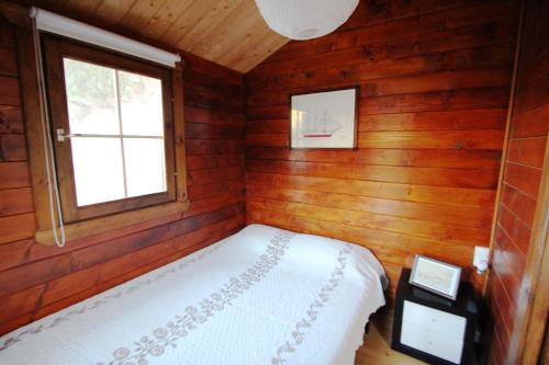 Кровать или кровати в номере Douro Yacht Charter & Bungalows