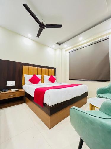 a bedroom with a large bed and a large screen at Hotel Royal Rosette with free Wi-Fi Near New Delhi Railway Station in New Delhi