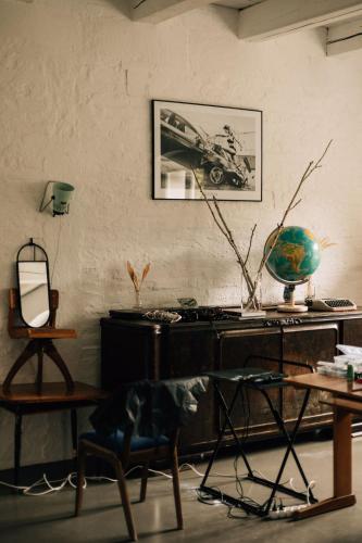 a room with a desk and a chair and a table at Ceglarnia in Książ Wielkopolski