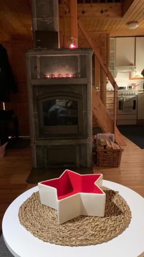a box on a table in front of a fireplace at Yllästölli 2 A, Äkäslompolo in Kolari