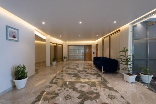 an office lobby with a couch and a rug at Ekant Retreat Resort in Chail