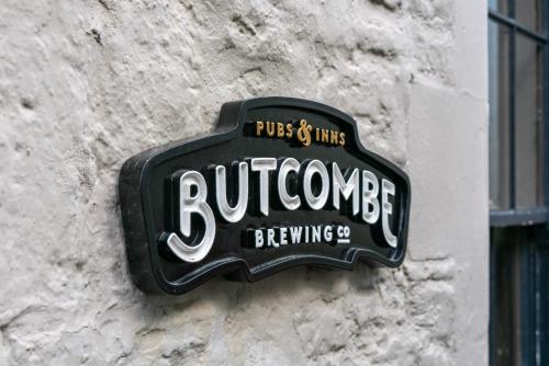 a sign on the side of a building at The Archangel,Restaurant & Bar with Rooms in Frome