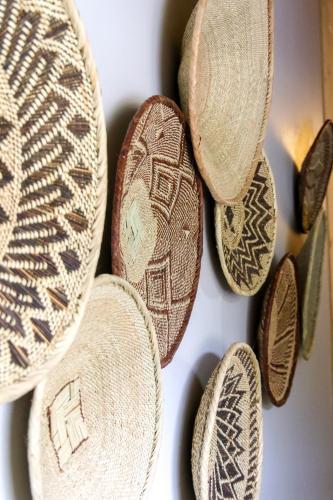 a group of different types of coins on a wall at Barefoot Addo Elephant Lodge in Addo