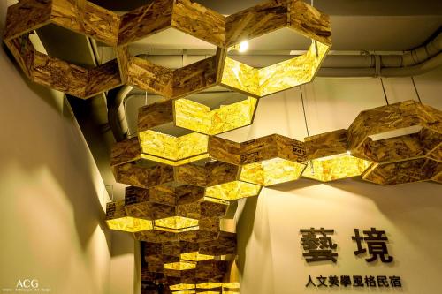 a room with a bunch of lights hanging from the ceiling at Art Zone in Hualien City