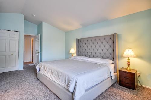 a bedroom with a large bed with blue walls at Charming Beaverton Retreat about 12 Mi to Downtown! in Beaverton