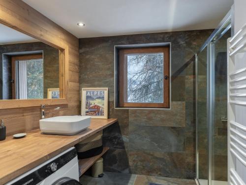 a bathroom with a sink and a shower at CHALET " JEANE " proche centre in Megève