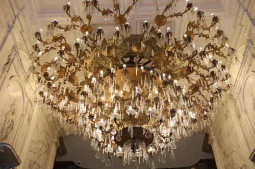 a large chandelier hanging from a ceiling in a building at Gran Hotel Ciudad de México Zócalo View in Mexico City