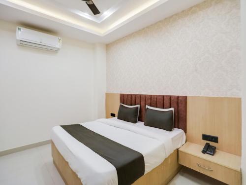 Katil atau katil-katil dalam bilik di Super Townhouse 1288 Magnolia Corporate Stays