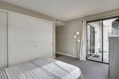 a bedroom with a bed and a sliding glass door at Downtown San Diego Condo in Marina District! in San Diego
