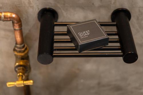 a metal box sitting on top of a pipe at Lilian Lofts Hotel & Spa in Johannesburg