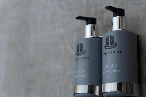 two black bottles sitting next to each other at Lilian Lofts Hotel & Spa in Johannesburg