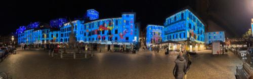 a building with blue lights on it at night at Santa Vincenza - Suite Indipendente in Lovere