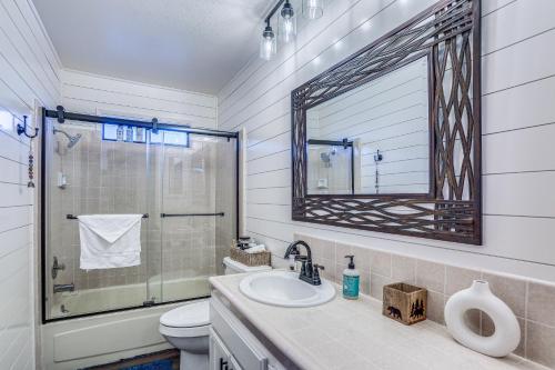 a bathroom with a sink and a toilet and a mirror at Mountain Home Near Yosemite with Well-Being Retreat! in Ahwahnee