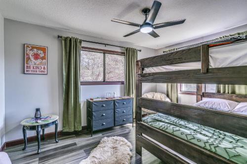 a bedroom with two bunk beds and a ceiling fan at Mountain Home Near Yosemite with Well-Being Retreat! in Ahwahnee