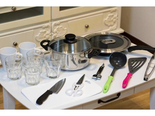 a kitchen counter with utensils and a pot on it at Mini Hotel Shinjuku Front - Vacation STAY 89788v in Tokyo