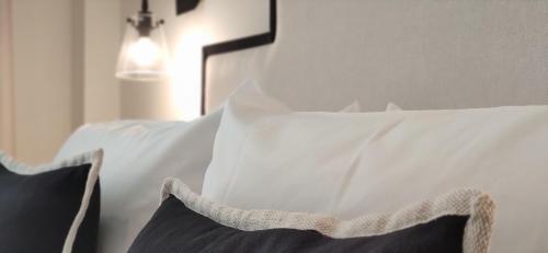 a close up of a pillow on a bed at Le Petit Boutique Hotel in Santander