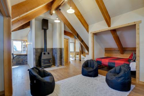 a living room with a couch and a fireplace at Riverside Colorado Chalet with Deck and Hot Tub in Dumont