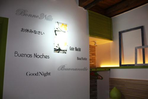 a wall with the names of different houses on it at Guest House La Casetta in Piazza Armerina