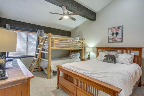 a bedroom with a bunk bed and a desk at Colorado Escape with Pool Access and Mountain Views! in Avon