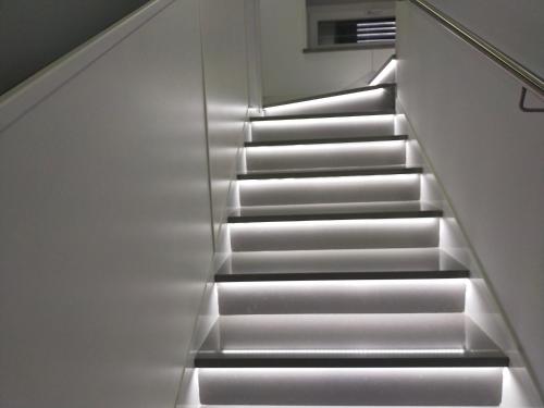 an escalator in a building with lights on it at Frontemare in Rossano