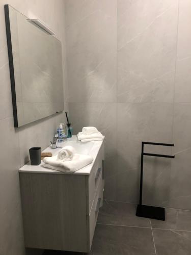 a bathroom with a sink and a mirror at Casa vacanze Savà in Lagaro