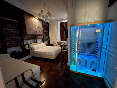 a living room with a large window with blue lights at Navona Central Suites in Rome