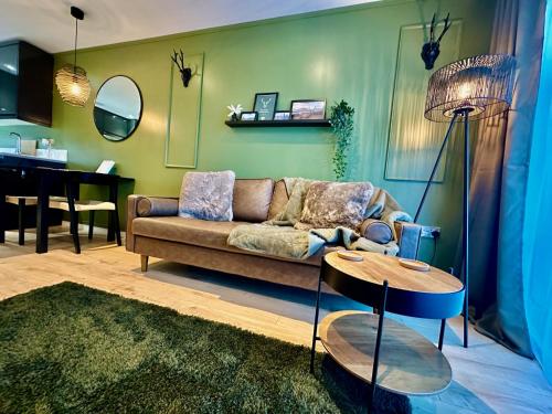 a living room with a couch and a table at The Stag City Centre Cosy 1 Bed Long Term Stays Welcome in Plymouth