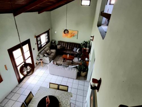 an overhead view of a living room with a couch at LARA'S HOUSE in São Sebastião