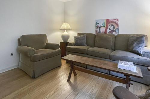 a living room with a couch and a chair and a table at Luke's Landing in Westport