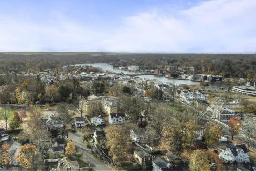 an aerial view of a town with a river and houses at Luke's Landing in Westport