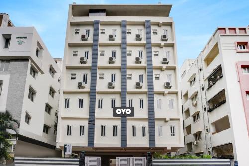 an apartment building with the oxo sign on it at OYO Flagship IKON Stay and Restaurant in Hyderabad