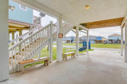 a porch of a house with a staircase and a bench at Family-Friendly Crystal Beach Home Steps to Beach in Crystal Beach