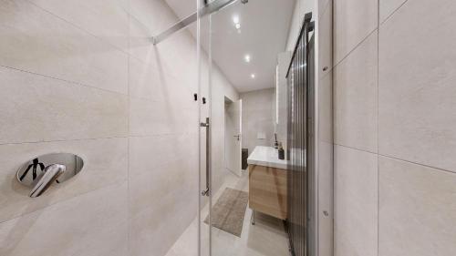 a bathroom with a shower and a sink at STAY SMART Luxembourg Dudelange Center in Dudelange