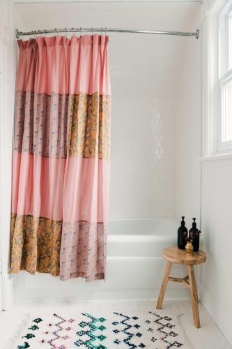 a room with a curtain and a table at Town & Trail - Walkable Wellington Charmer in Wellington