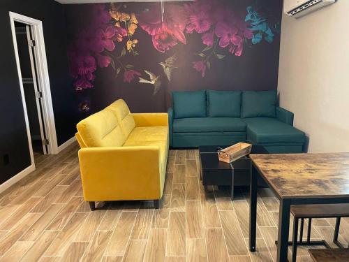 a living room with a couch and a table at New Stylish Midtown With One Bedroom (Unit D) in Phoenix