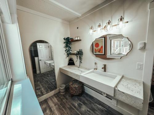 a bathroom with a sink and a mirror at Woody Mountain Bed & Breakfast in Flagstaff