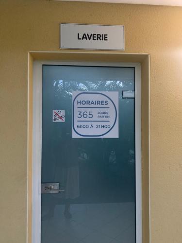 a sign above a door with a sign above it at Sous les tropiques in La Trinité