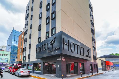 a building with a sign for a hotel at Hotel Flamencos in Mexico City