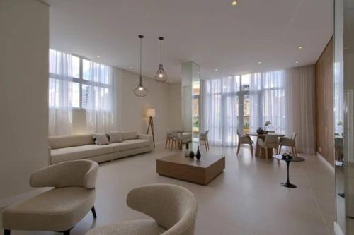 Posezení v ubytování Flat sensacional 5 pessoas em condomínio moderno 2 suites climatizados