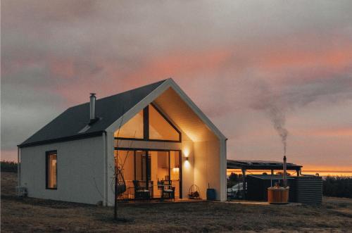 a small house in the middle of a field at Glenbosch Wine Estate Farm Stays in Beechworth