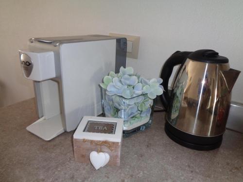 a coffee maker and a tea kettle on a counter at Casa Bijou in Pula