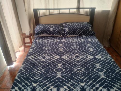 En eller flere senge i et værelse på Casa de hóspedes nos Carianos perto do aeroporto