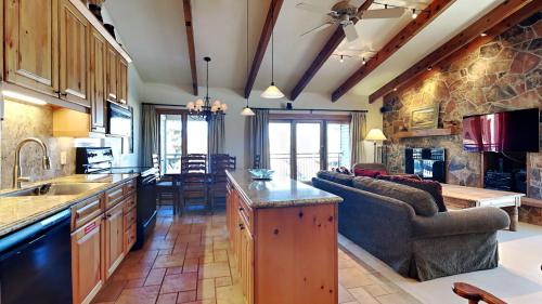 a kitchen and living room with a couch and a table at Timberline Condominiums 3 Bedroom Deluxe unit C3A in Snowmass Village