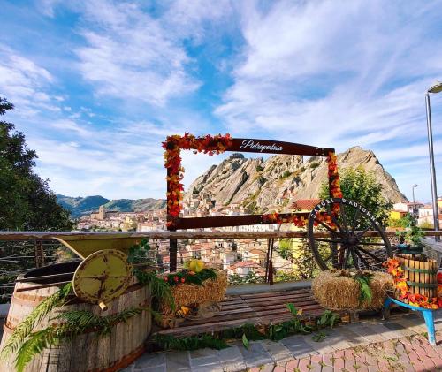 a wedding arch with a mountain in the background at Pietrapantone B&B in Pietrapertosa