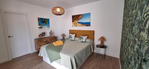 a bedroom with a bed in a room at Casilla de Costa Luz Home con Terrazza Fronte Piscina in La Oliva